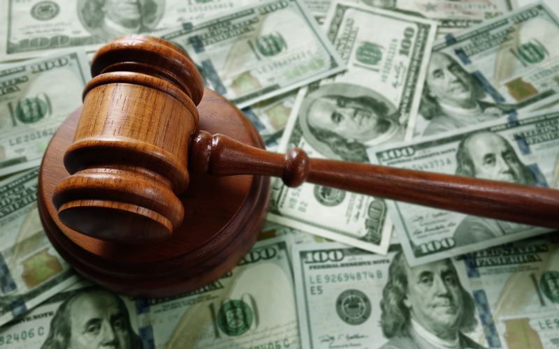 mallet on top of money