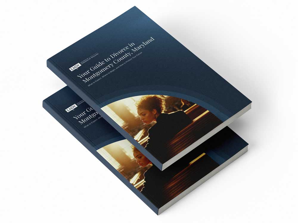 Mockup of the "Your Guide to Divorce in Montgomery County, Maryland" booklet, featuring a woman seated in a courtroom under warm sunlight and a navy modern cover design.