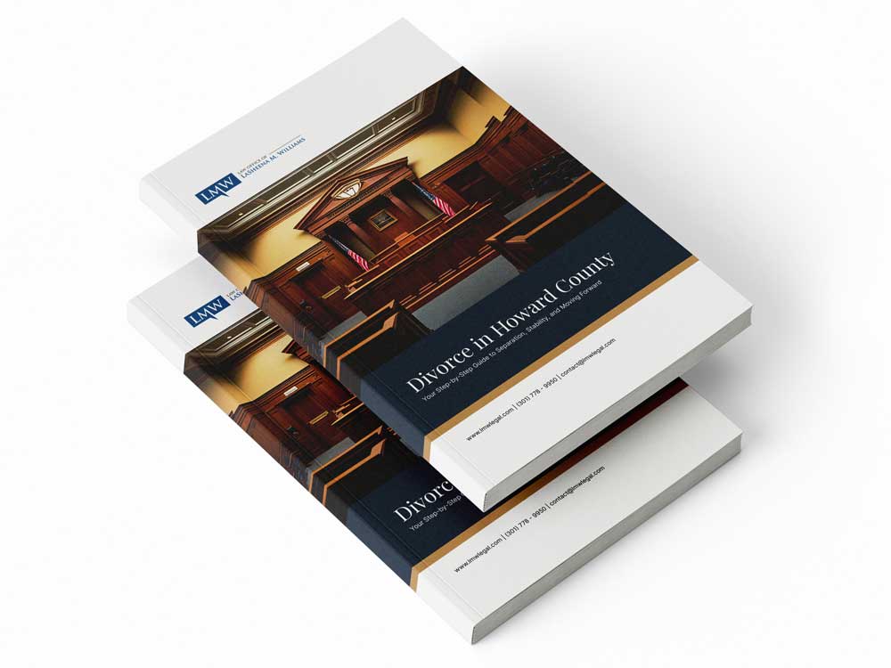 Mockup of the "Divorce in Howard County" legal guide, featuring a judge’s bench in a courtroom with gold accent lines on a navy and white cover.